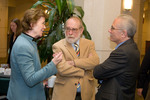 Mary Robinson speaks with two participants